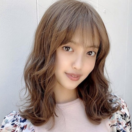 川崎のパーマスタイルの女性の写真