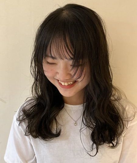 ELM Tokyoの女性らしいパーマスタイルの写真